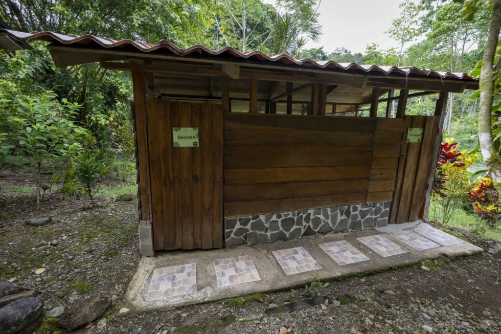 Pacuare River Ecolodge outdoor shower facility in lush forest setting