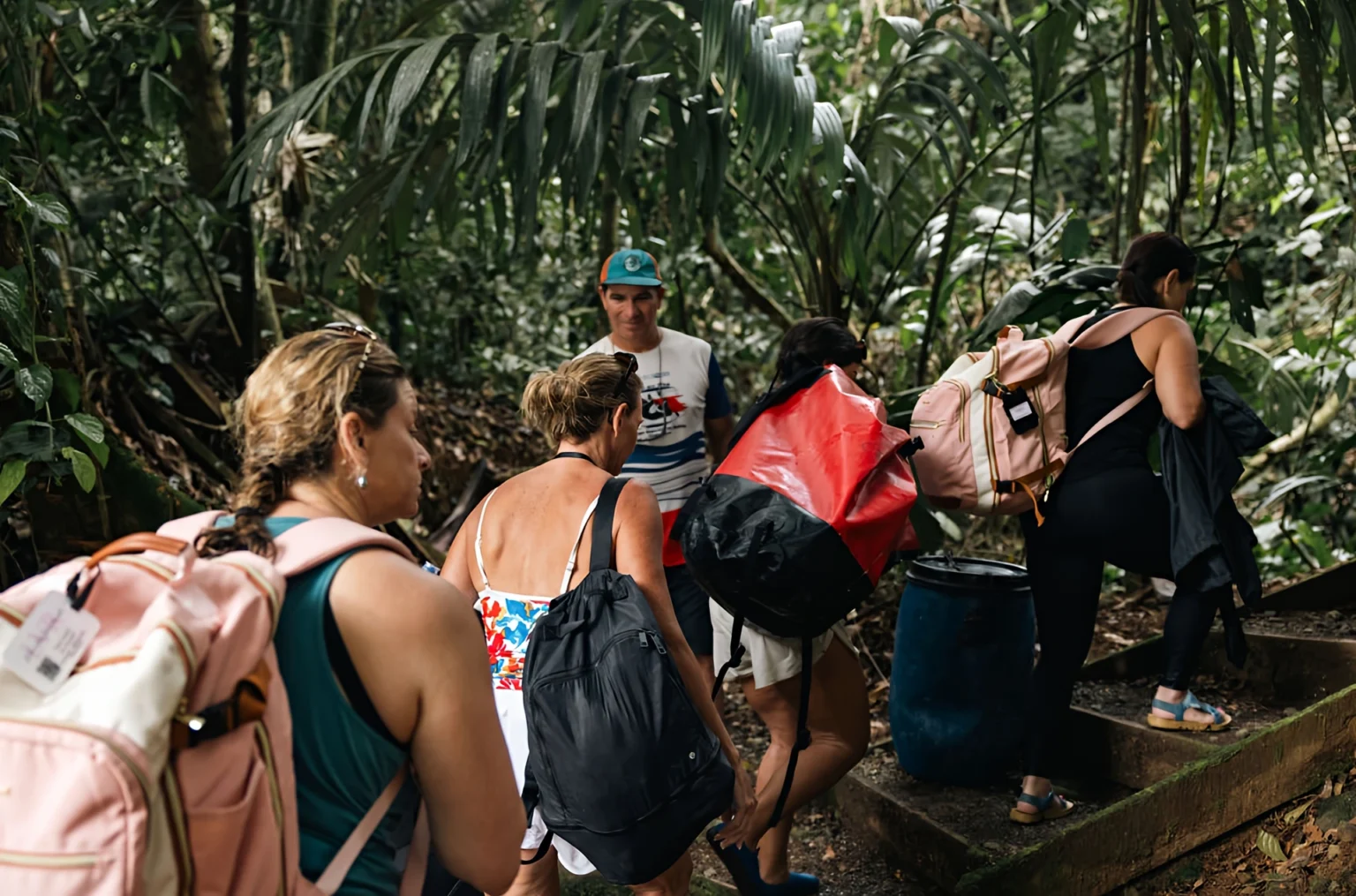 Pacuare River Ecolodge guests hiking lush jungle trail