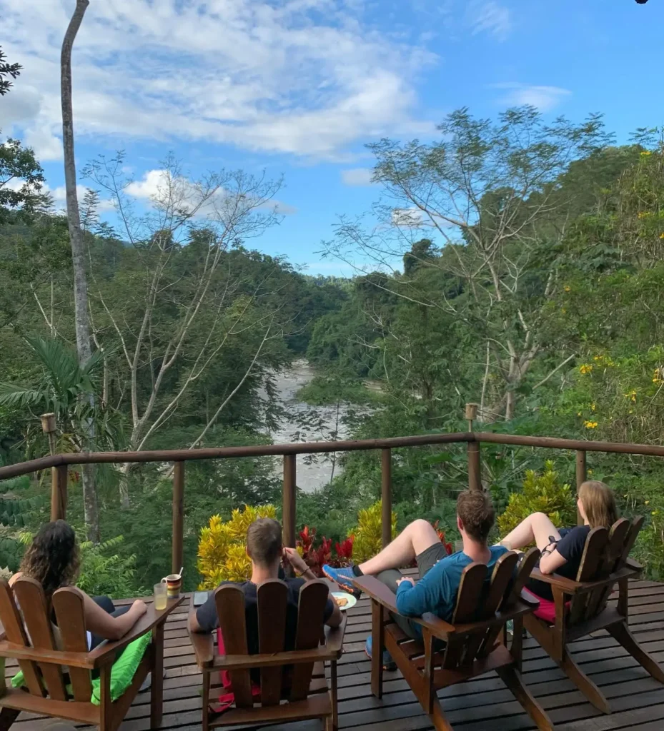 Pacuare River Ecolodge guests relaxing with river view