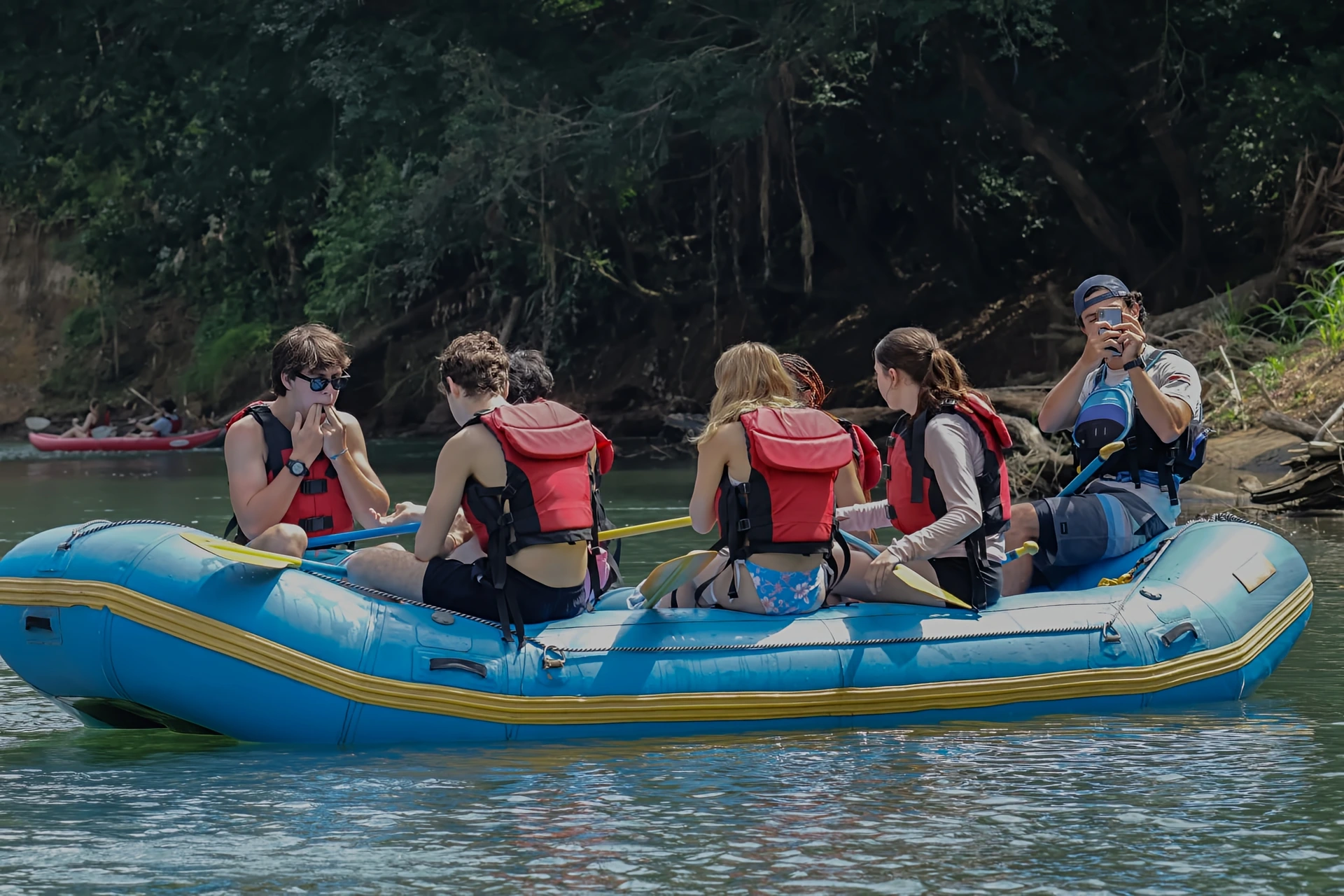Pacuare River rafting group in blue inflatable boat