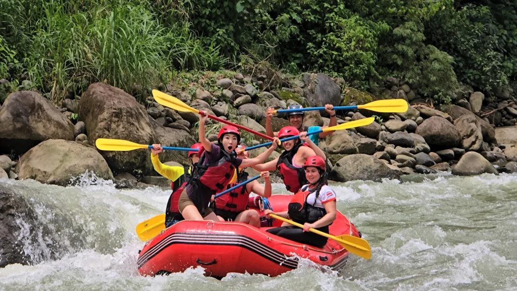 Pacuare River rafting adventure, group enjoying rapids in inflatable boat