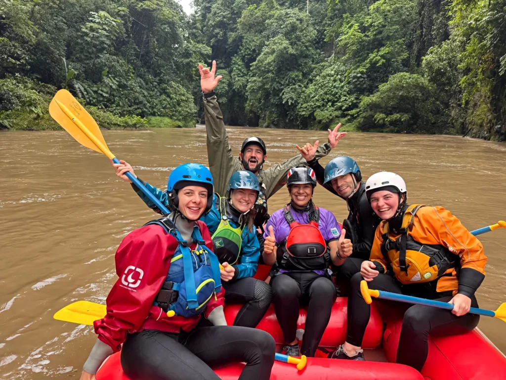 Pacuare River rafting group smiling, lush jungle background