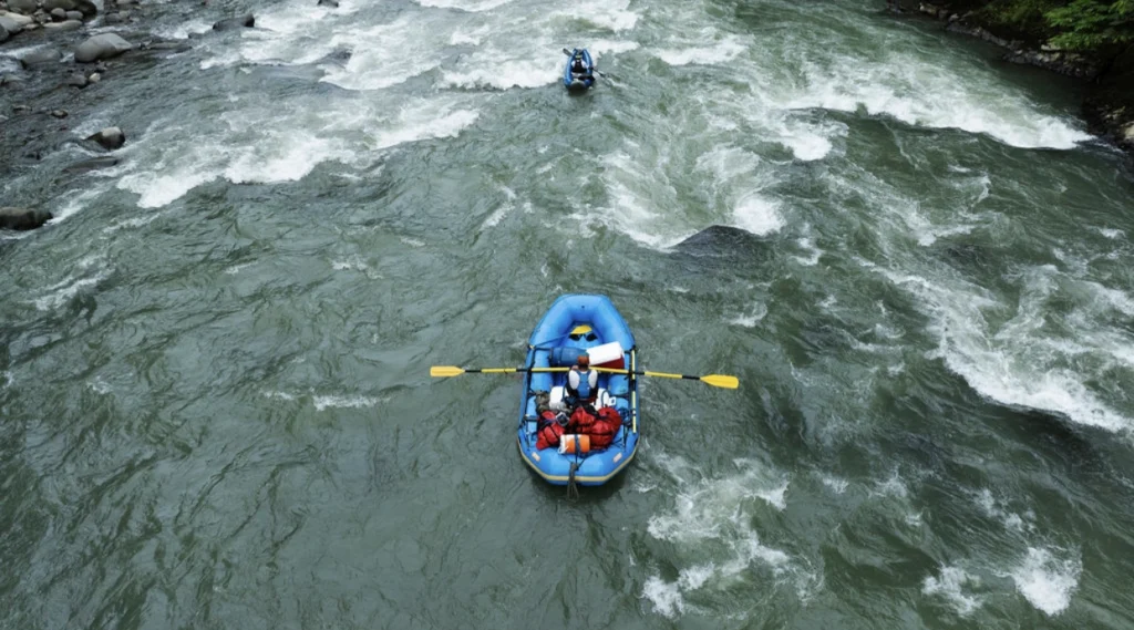 Pacuare River rafting adventure, blue raft navigating rapids.