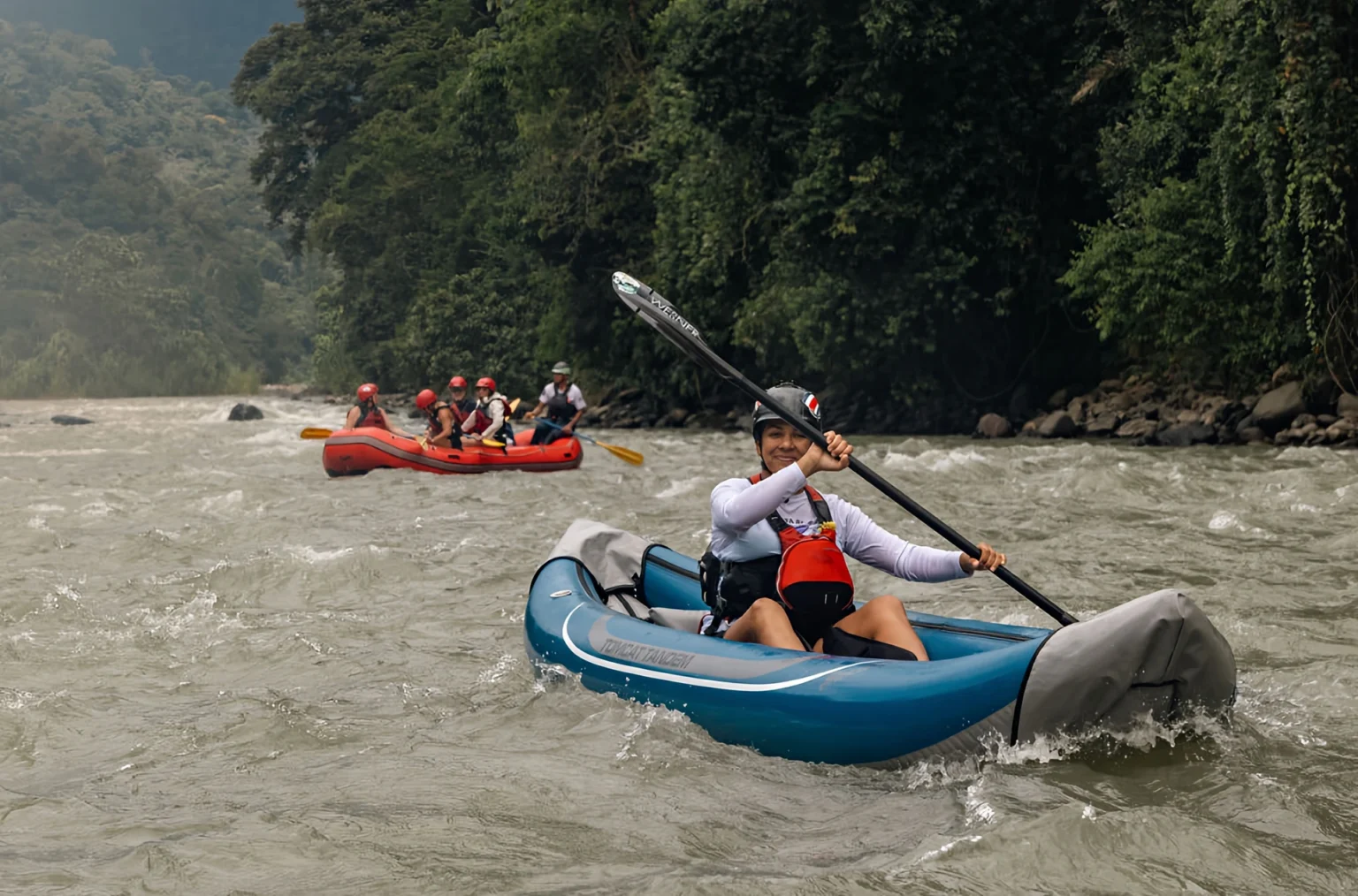 Pacuare River rafting adventure, people kayaking through rapids