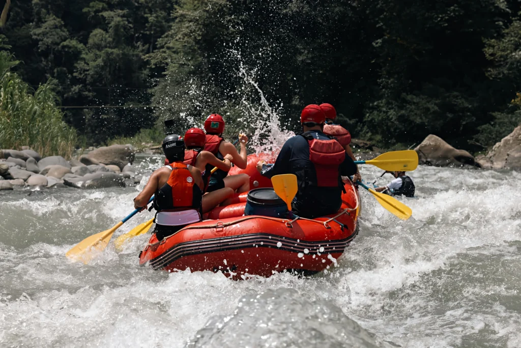 Whitewater rafting adventure on Pacuare River, group in red raft.