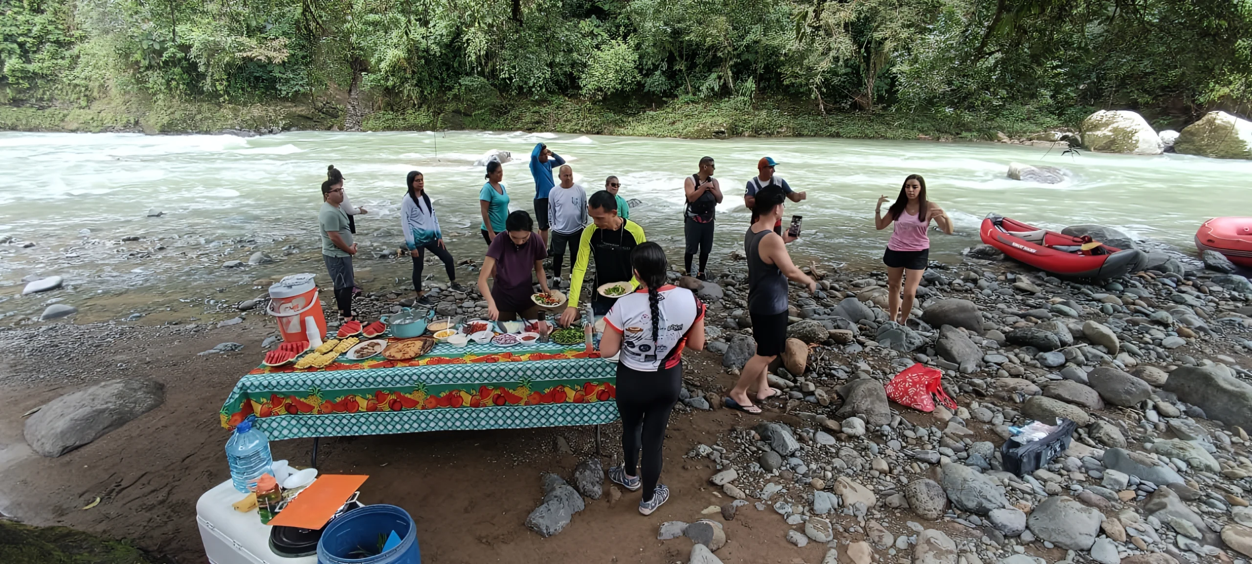 Pacuare River rafting group with rafts on rocky shore